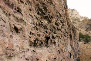 A person climbing a rock wall.