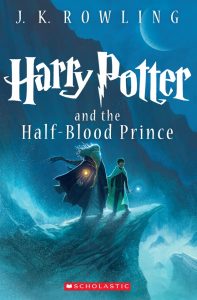 Book cover for Harry Potter and the Half-Blood Prince by J.K. Rowling, showing two figures in cloaks standing on a rocky cliff with glowing light, under a dark, moonlit sky. The Scholastic logo is at the bottom.