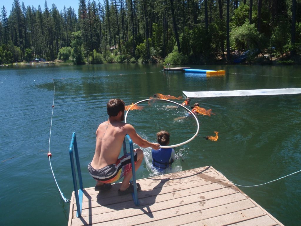 jump into the lake through a flaming hoop!